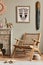 Fancy mediterranean interior of living room with mock up poster frame, design armchair, shelf, decoration, carpet.