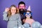 Fancy party. Family of father and daughters wearing party goggles. Family party. Happy family celebrating birthday party