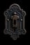 fancy retro vintage Victorian keyhole. Intricate details. Black background.