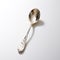 Fancy Silver Spoon With Shiny Bumpy Texture On White Background