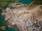 Fancy and unusual aerial landscape of Romantsev mountains wih blue lakes and mud erosion looks like alien surface of