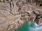 Fancy and unusual aerial landscape of Romantsev mountains wih blue lakes and mud erosion looks like alien surface of