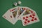 Fanned Out Red Hearts Poker Royal Flush and Dice on Green Baize