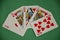 Fanned Out Winning Hand Poker Royal Flush on Green Baize Table