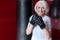 Fanny smiling gray haired woman preparing to boxing.