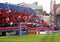 Fans waving flags at football game