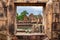 Fantastic ancient ruins of Prasat Muang Tao, view through the window Near Phanom Rung Prasat Historical Park.