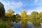 Fantastic autumn landscape with yellow trees near the pond (rest, relaxation, anti-stress - concept)