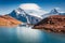 Fantastic autumn scene of Bachsee lake with Wetterhorn and Wellhorn peaks on background. Colorful summer morning in Bernese Oberla