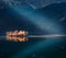 Fantastic autumn scene of Eibsee lake. Unbelievable morning view of first sunlight glowing small island on bottom of the Zugspitze