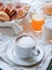 Fantastic breakfast of cappuccino, croissants , orange juice an