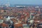 Fantastic Bruges city skyline with red tiled roofs, The Poortersloge Burgherâ€™s Lodge tower and windmills in the background.