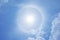 A fantastic circular Halo around the Sun , Natural light phenomena around the Sun with blue sky and clouds