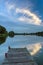 Fantastic cloud above the water with a jetty