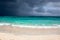 Fantastic clouds contrast on caribean beach