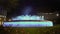 Fantastic dancing fountain, illuminated water streams moving to music at night