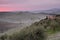 Fantastic dawn over tuscan hills in winter with morning rime , T