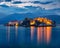 Fantastic evening cityscape of Stresa town. Splendid summer night on Maggiore lake with Bella island on background, Province of Ve