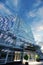 Fantastic glass facade of a modern building in the evening and a blue sky