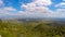 Fantastic green eco landscape with white clouds in blue sky, hilly terrain