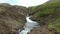 Fantastic landscape with flowing rivers and streams with rocks and grass in Iceland