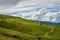 Fantastic landscape with path that climbs towards a hut seen from the Fittanze Di Sega Pass, in Lessinia, near Verona