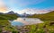 Fantastic landscape at sunrise over the lake in the Swiss Alps,