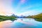 Fantastic landscape at sunrise over the lake in the Swiss Alps, Europe. Wetterhorn, Schreckhorn, Finsteraarhorn et Bachsee.