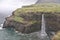 Fantastic landscape with village of Gasadalur and waterfall Mulafossur on the Vagar Island of the Faroe Islands.