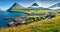 Fantastic morning view of Gjogv village. Sunny summer scene of Eysturoy island. Nice seascape of Atlantic ocean, Faroe Islands, De