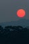 Fantastic the red sun setting above the deep jungle and mountain range. Khao Yai, Thailand