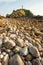 Fantastic scenery stone beach at sunset, mountain light house blurred backgrounds. Lanta Island, Thailand