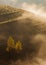 Fantastic shot of a mountain covered in fogs in Transylvania, Romania during sunrise