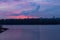 Fantastic soft sun setting clouds. Majestic sunset landscape of autumn Kyiv. Clouds reflected in tranquil water of Dnipro River.