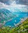 Fantastic summer cityscape of Kotor port. Aerial morning view of Kotor bay and  limestone cliffs of Mt. Lovcen. Sunny Adriatic