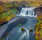 Fantastic summer scenery. Picturesque morning scene of waterfall on Skoga river.