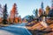 Fantastic sunny view of Dolomite Alps with yellow larch trees. Colorful autumn scene in mountains. Giau pass location, Italy,