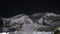 Fantastic timelapse. Alpinists lights move up on glacial slope under starry sky