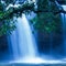 Fantastic tropical waterfall under the moonlight, gently water falling on the cliff, as a watercolor painting. Khao Yai, Thailand