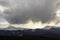 Fantastic view of huge white dark foreboding stormy cloud covering blue sky low over mountains Hoverla and Petros in Carpathian m