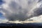 Fantastic view of huge white dark foreboding stormy cloud covering blue sky low over mountains Hoverla and Petros in Carpathian mo