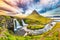 Fantastic view on Kirkjufellsfoss waterfall  near Kirkjufell mountain at sunset