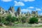 Fantastic View to the GÃ¶reme with rock houses in front of the spectacularly coloured valleys nearby,