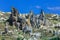 Fantastic View to the GÃ¶reme with rock houses in front of the spectacularly coloured valleys nearby,