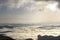 Fantastic wide top view of mountain valley filled with white puffy like snow clouds and fog stretching to horizon under bright mor