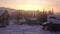 Fantastic winter landscape. Beautiful winter scene at sunset. Village in the snowy mountains at amazing sunrise