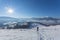 Fantastic winter landscape and trodden tourist path leading into the mountains. On the eve of the holiday.