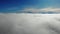 Fantastically beautiful rise above the clouds. Flying through the clouds. On the background of mountain peaks in winter