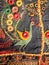 Fantasy bird and patterns on traditional Indian patchwork handmade carpet.