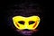 Fantasy mystery golden mask isolated on modern black wooden background - Halloween & murder concept